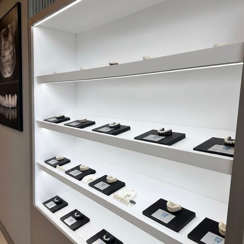 Rows of zirconia and E.max arch samples patients compare in person